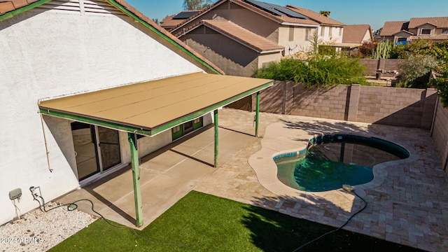 view of swimming pool with a patio