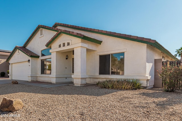 view of front of home with a garage