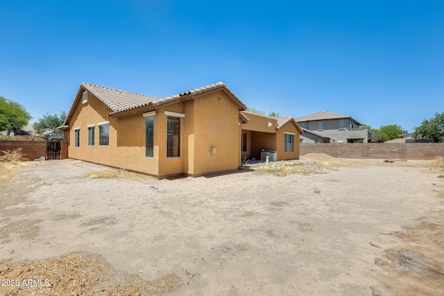19617 S 190th St, Queen Creek, AZ 85142 - rear view of house featuring a tile roof, stucco siding, and fence