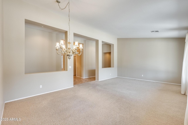 19617 S 190th St, Queen Creek, AZ 85142 - unfurnished room featuring a chandelier, carpet flooring, and baseboards