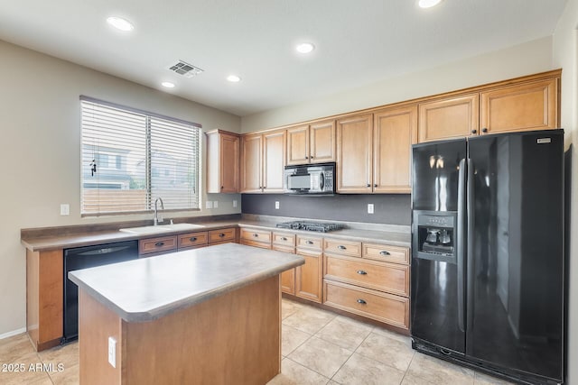 19617 S 190th St, Queen Creek, AZ 85142 - kitchen with black appliances, a sink, light tile patterned flooring, recessed lighting, and a center island
