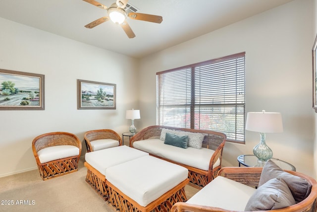 living room featuring light carpet and ceiling fan