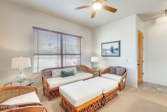 living room featuring light carpet and ceiling fan