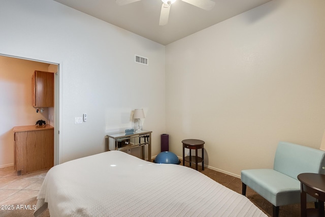 tiled bedroom with ceiling fan