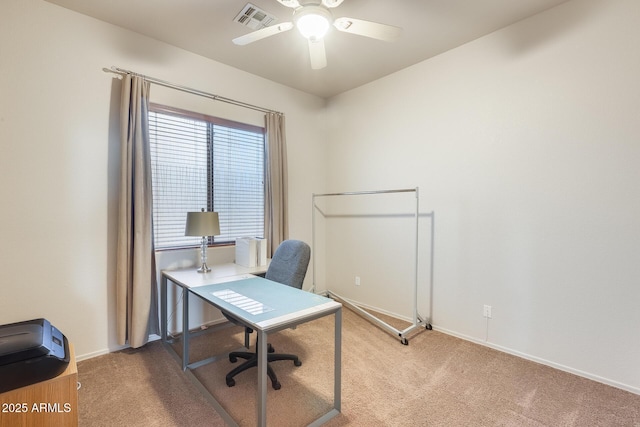 home office with ceiling fan and light carpet