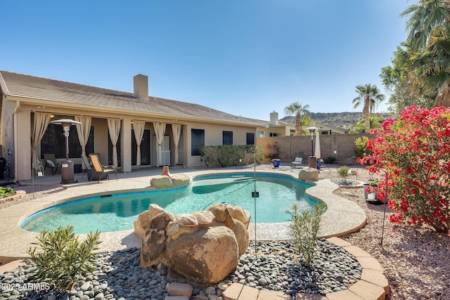 view of pool featuring a patio area