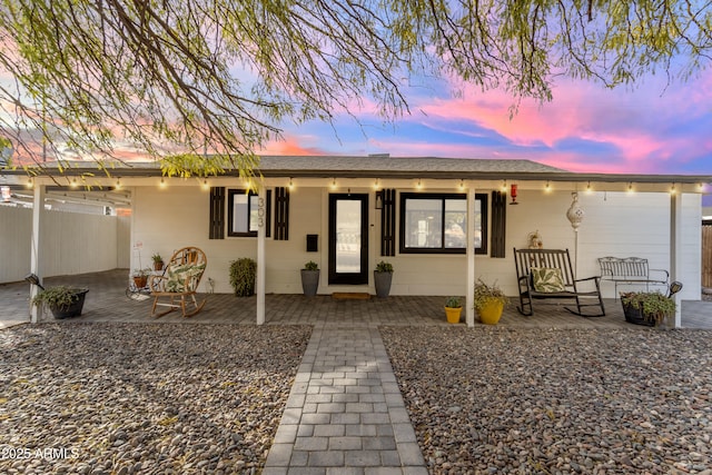 ranch-style house with covered porch