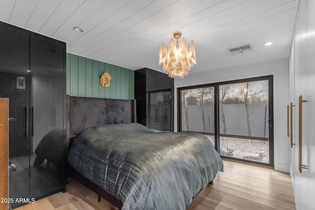 bedroom with light wood-type flooring, access to exterior, an inviting chandelier, and wood ceiling