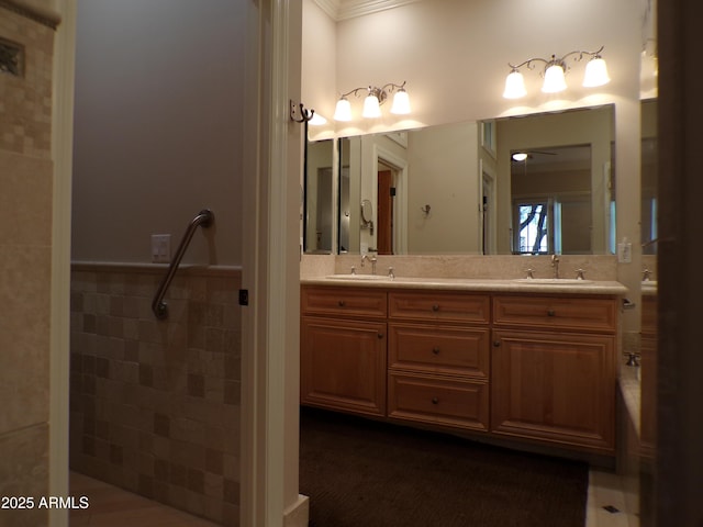 bathroom featuring vanity and tile walls