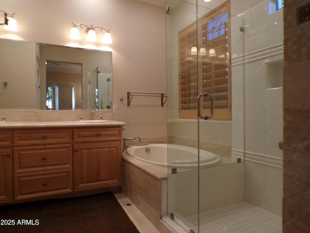 bathroom with vanity and separate shower and tub