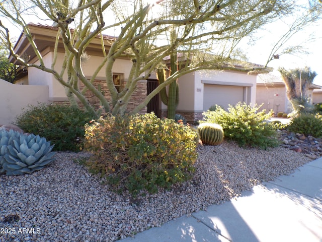 view of side of home with a garage