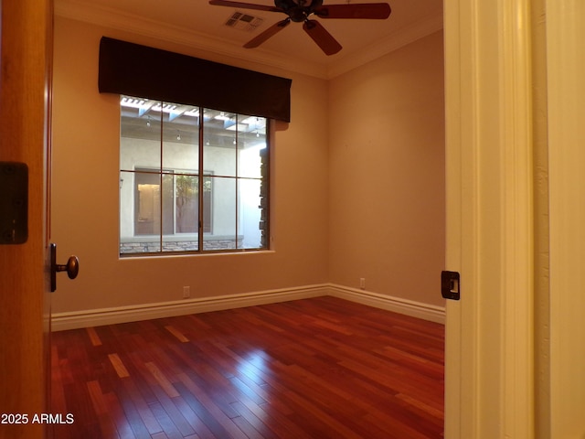 spare room featuring crown molding, ceiling fan, and hardwood / wood-style flooring