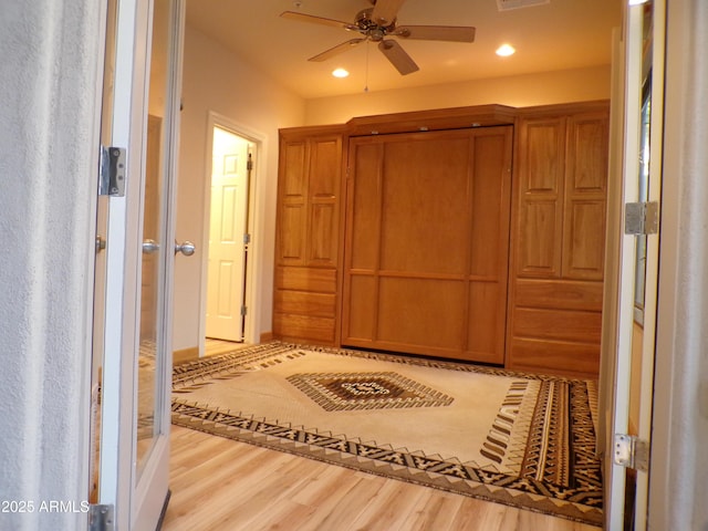 corridor featuring light hardwood / wood-style flooring