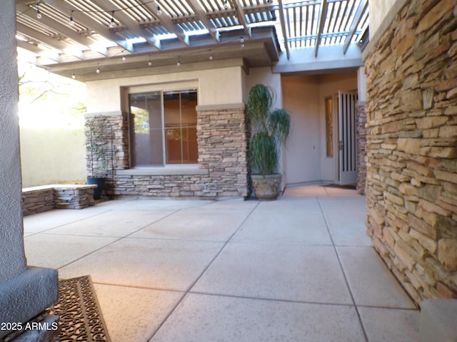 view of patio featuring a pergola