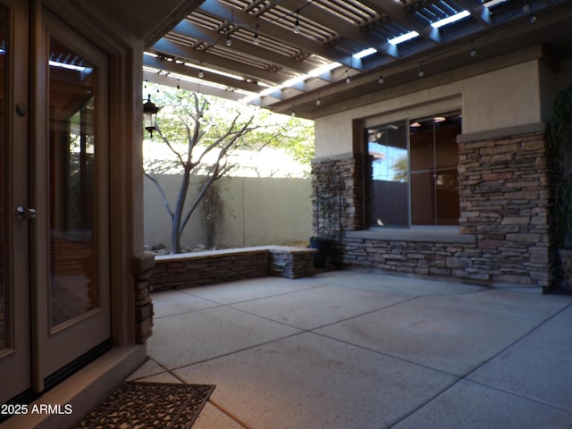 view of patio featuring a pergola