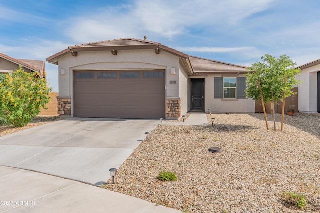 19407 W Pierson St, Litchfield Park, AZ 85340 - view of front of property featuring concrete driveway, stucco siding, stone siding, and a tiled roof