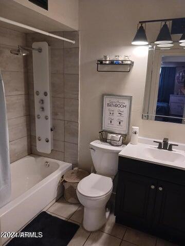5539 N 31st Ln, Phoenix, AZ 85017 - full bath with tile patterned flooring, toilet, vanity, and bathtub / shower combination