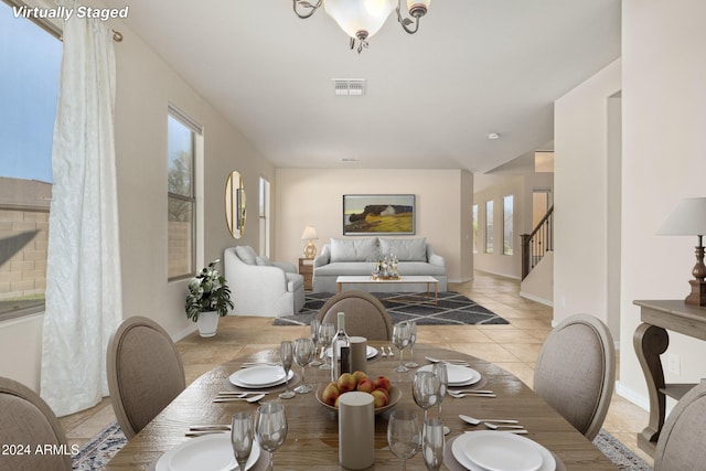 dining space featuring light tile patterned flooring