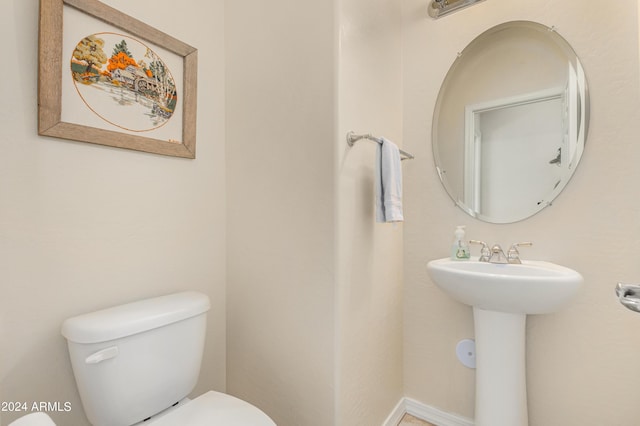 bathroom with sink and toilet