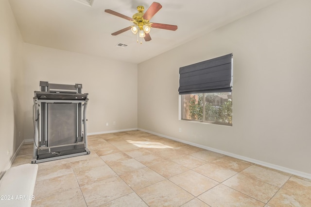 empty room featuring light tile patterned floors and ceiling fan