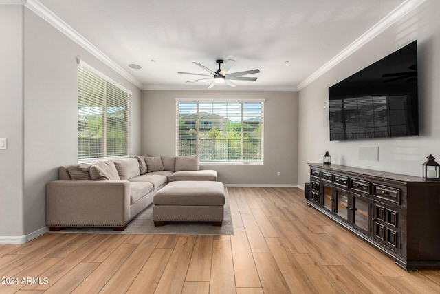 living room with crown molding, ceiling fan, and light wood-type flooring