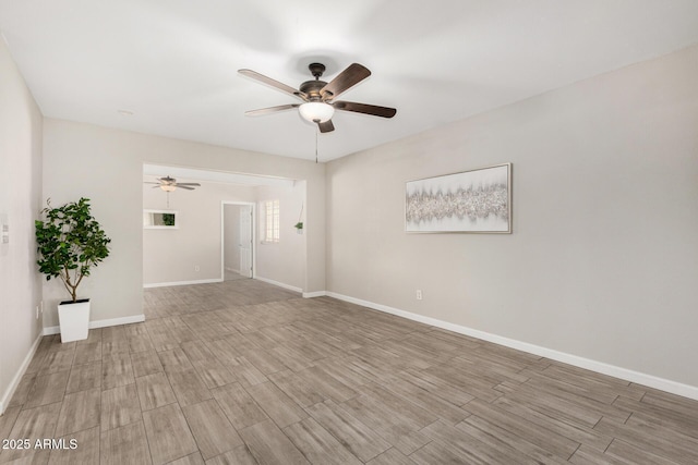 5649 W Holly St, Phoenix, AZ 85035 - empty room featuring a ceiling fan and wood finished floors