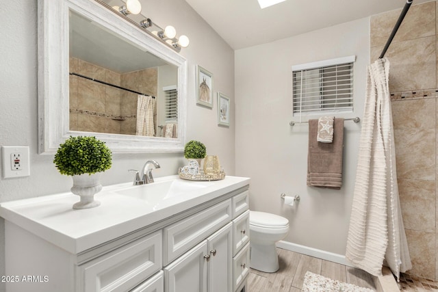 5649 W Holly St, Phoenix, AZ 85035 - bathroom featuring vanity, wood finished floors, and a tile shower