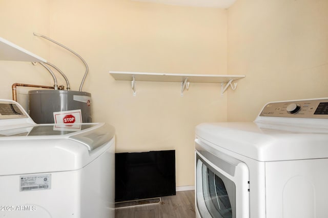 5649 W Holly St, Phoenix, AZ 85035 - laundry room with washing machine and clothes dryer, water heater, and wood finished floors