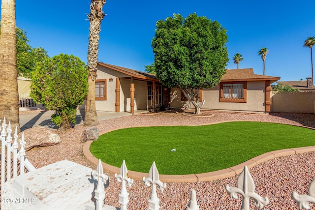 5649 W Holly St, Phoenix, AZ 85035 - back of house with stucco siding and a patio