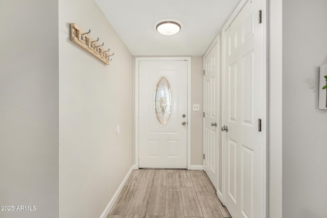 5649 W Holly St, Phoenix, AZ 85035 - doorway with light wood-style floors and baseboards