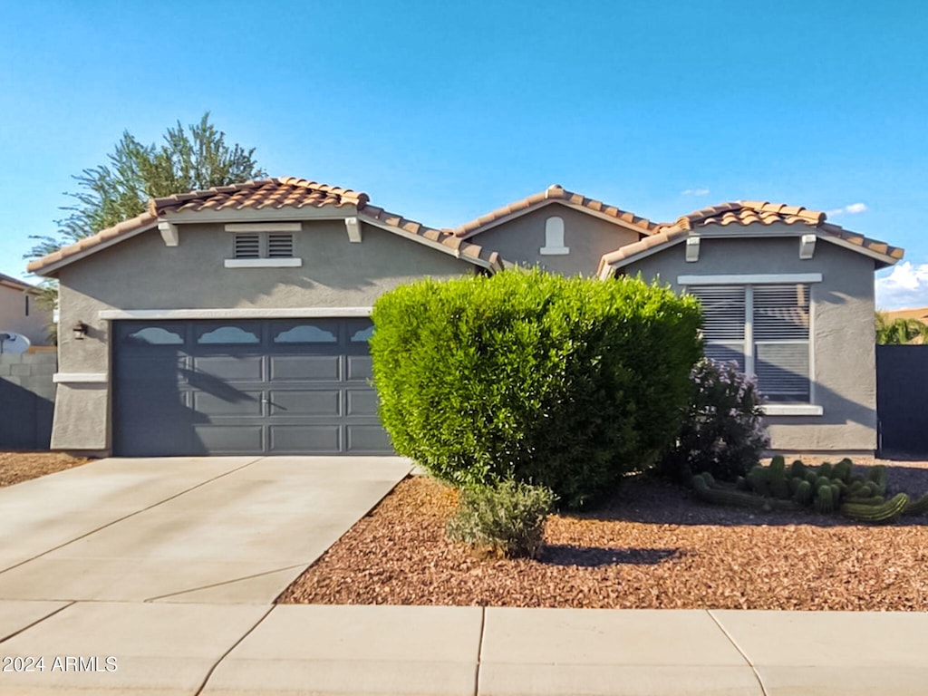 mediterranean / spanish-style house featuring a garage