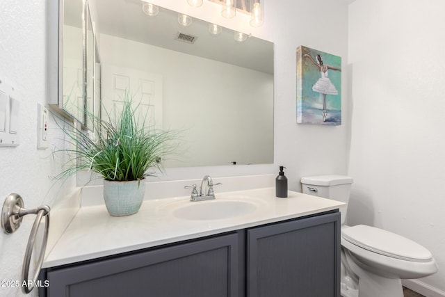 8648 W Fargo Dr, Peoria, AZ 85382 - bathroom featuring toilet, visible vents, and vanity