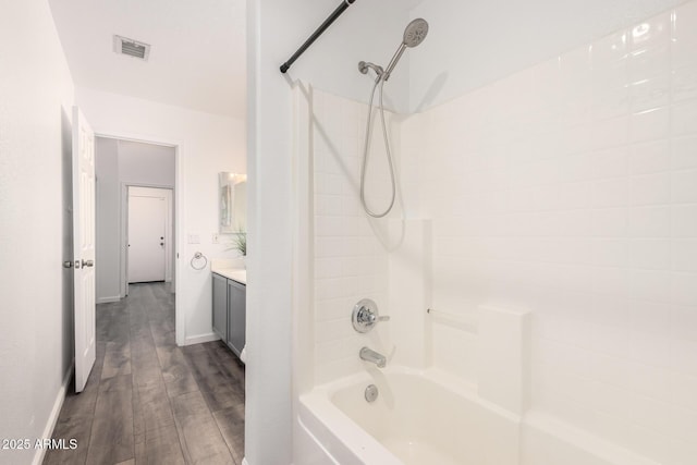 8648 W Fargo Dr, Peoria, AZ 85382 - full bath with vanity, visible vents, baseboards, wood finished floors, and  shower combination