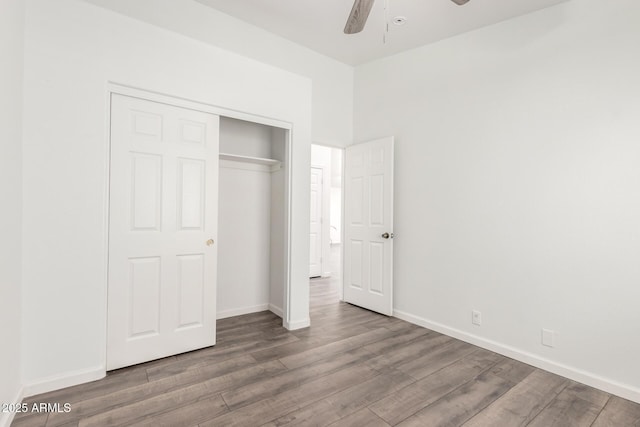 8648 W Fargo Dr, Peoria, AZ 85382 - unfurnished bedroom featuring a closet, ceiling fan, wood finished floors, and baseboards