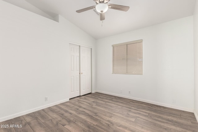 8648 W Fargo Dr, Peoria, AZ 85382 - empty room featuring lofted ceiling, wood finished floors, ceiling fan, and baseboards