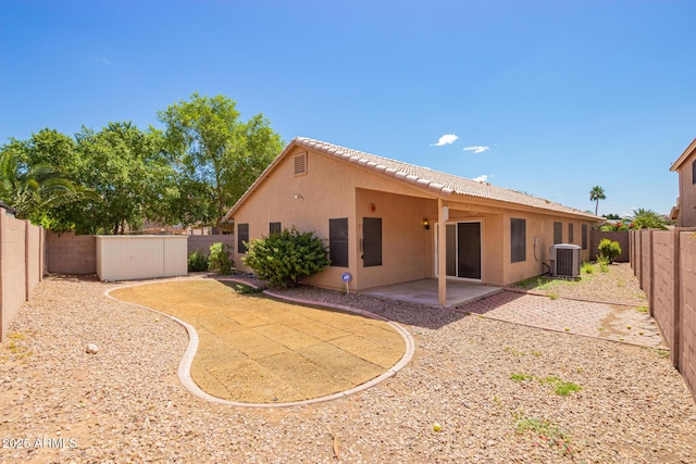 8648 W Fargo Dr, Peoria, AZ 85382 - rear view of house with cooling unit, a tiled roof, a patio area, stucco siding, and a fenced backyard