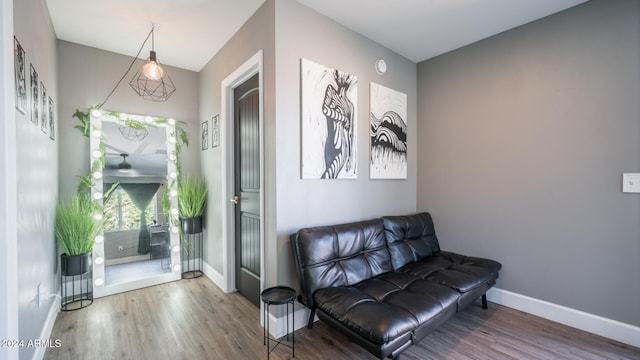 sitting room with hardwood / wood-style flooring