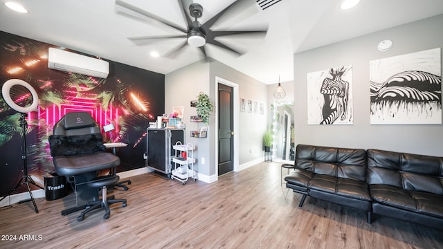 living room featuring hardwood / wood-style floors, ceiling fan, lofted ceiling, and a wall unit AC