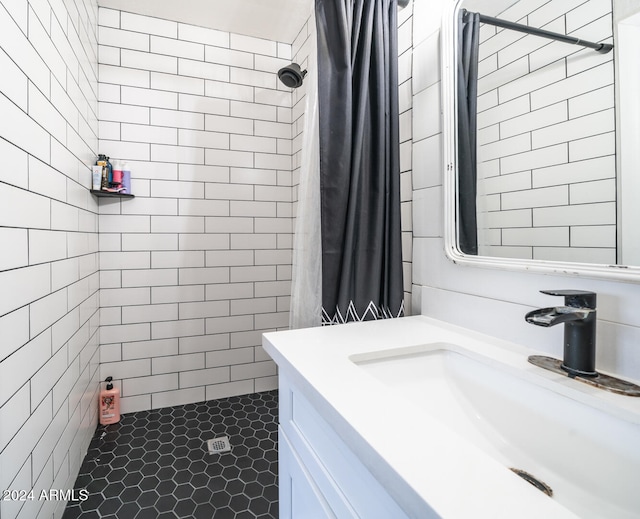 bathroom featuring a shower with curtain, vanity, and tile patterned flooring