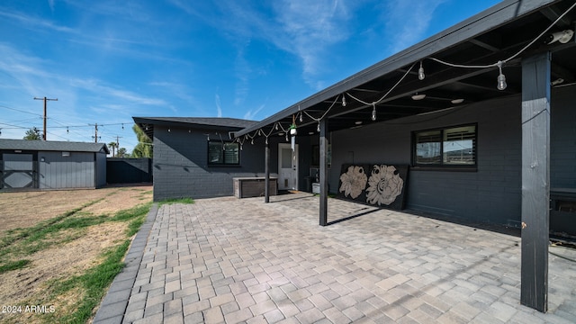 view of patio / terrace featuring a storage shed