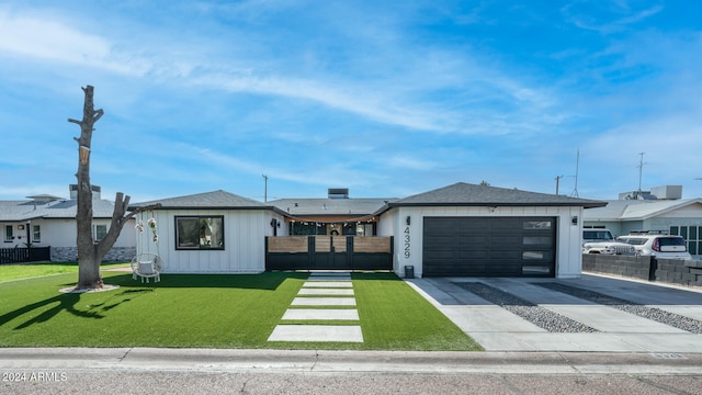 single story home featuring a front yard and a garage