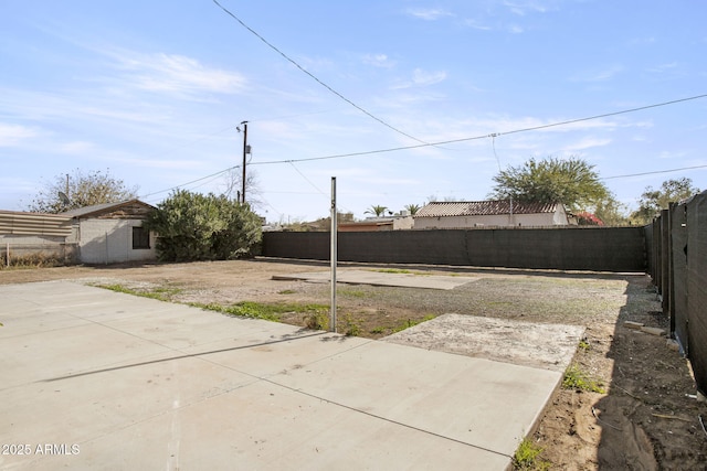 view of yard with a fenced backyard and a patio