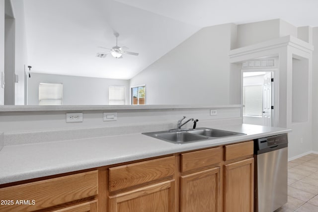 kitchen featuring a sink, dishwasher, a ceiling fan, light tile patterned floors, and lofted ceiling