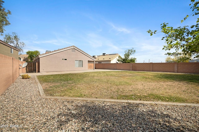 view of yard with a fenced backyard and a patio area