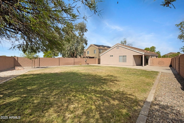 view of yard with a fenced backyard and a patio