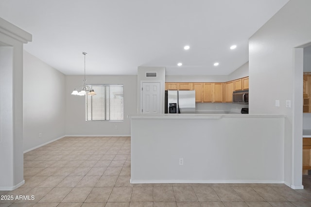 kitchen with visible vents, baseboards, light countertops, appliances with stainless steel finishes, and a notable chandelier