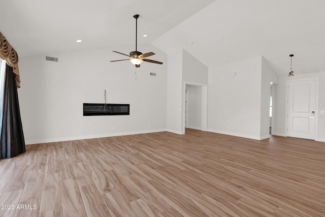 1336 E Belmont Ave, Phoenix, AZ 85020 - unfurnished living room with a glass covered fireplace, light wood-style floors, ceiling fan, recessed lighting, and high vaulted ceiling