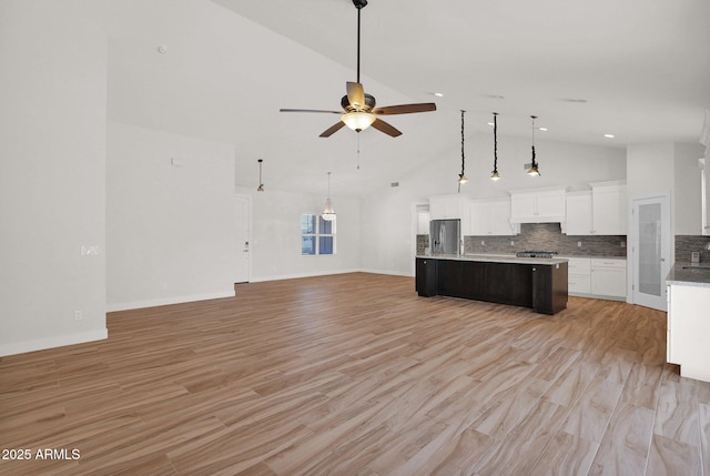 1336 E Belmont Ave, Phoenix, AZ 85020 - kitchen featuring stainless steel fridge, open floor plan, high vaulted ceiling, ceiling fan, and a center island