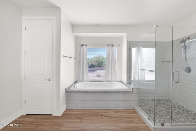 1336 E Belmont Ave, Phoenix, AZ 85020 - full bathroom featuring a bath, a stall shower, and wood finished floors