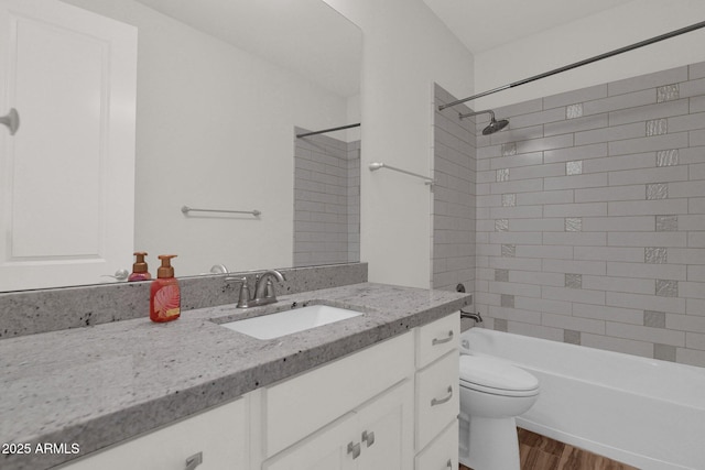 1336 E Belmont Ave, Phoenix, AZ 85020 - bathroom featuring vanity, wood finished floors, and washtub / shower combination